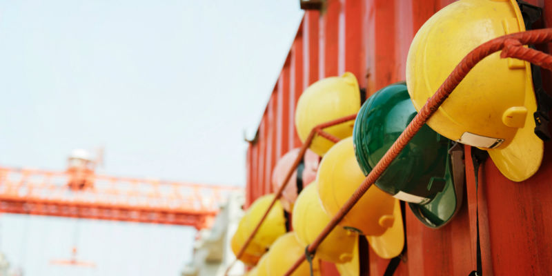 Helmets hanging up on a construction site