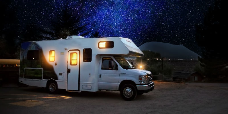 Motorhome under starry sky  