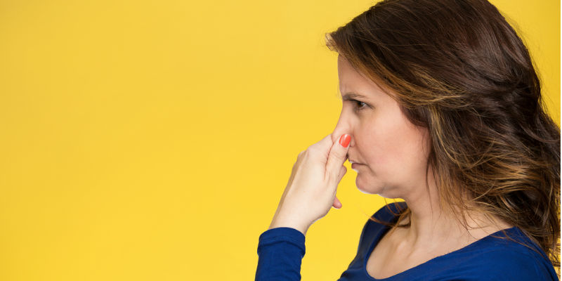 Woman pinching nose